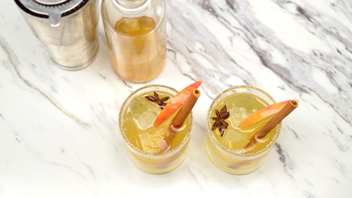 two glasses of spiced apple kombucha mocktail