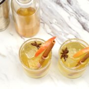 two glasses of spiced apple kombucha mocktail