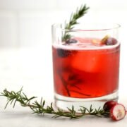 glass of cranberry ginger kombucha mocktail