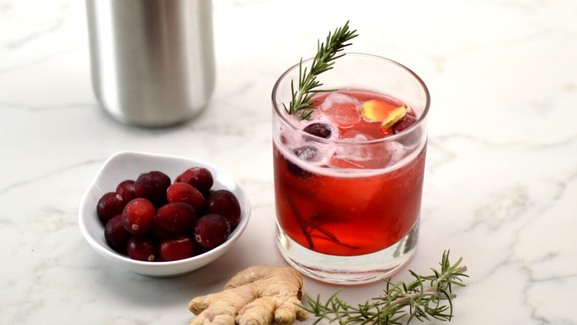 glass of cranberry ginger kombucha mocktail