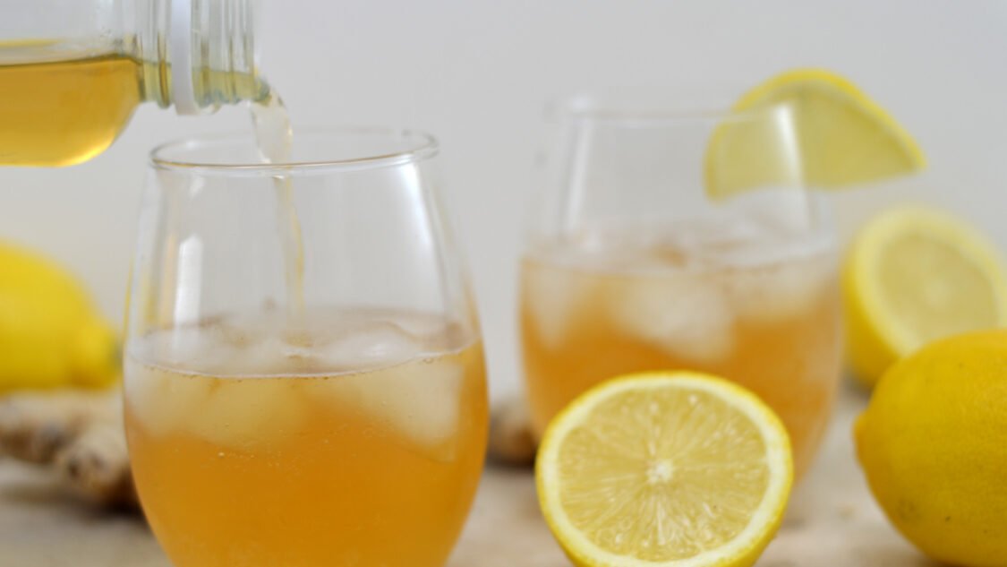 pouring lemon gingerade kombucha