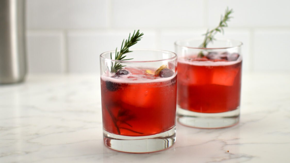 two glasses of cranberry ginger kombucha mocktail