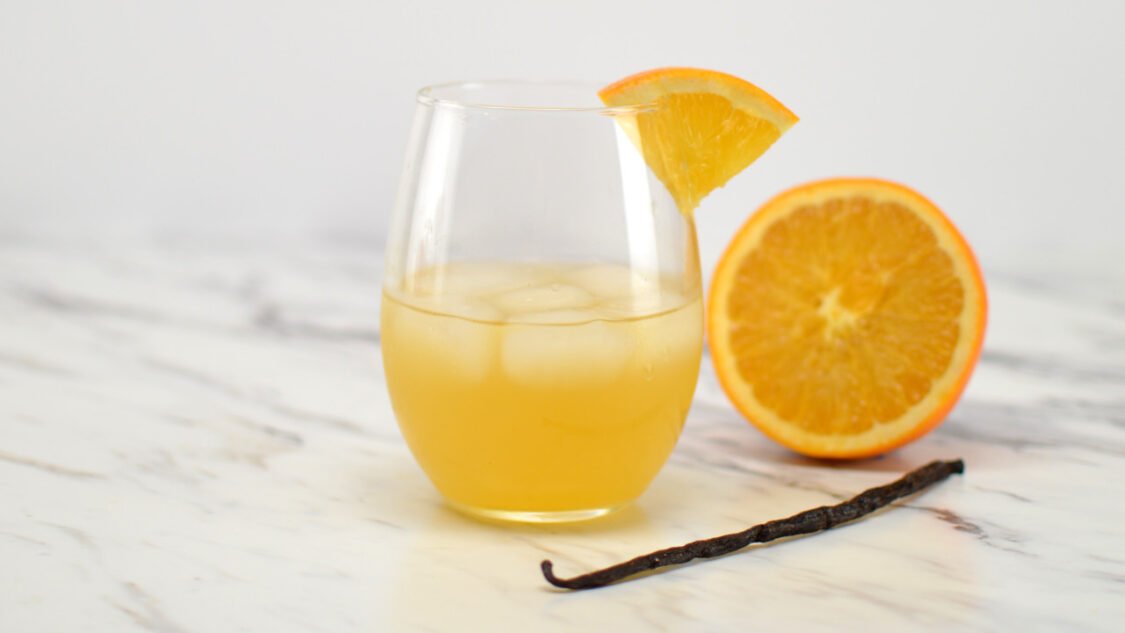 glass of orange creamsicle kombucha