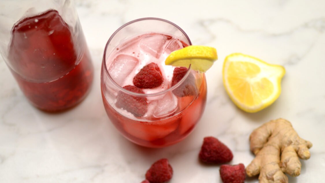 glass of raspberry gingerade kombucha