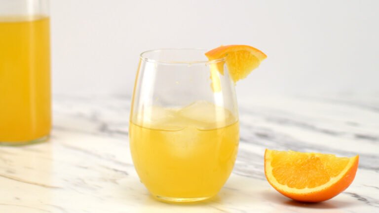 glass of orange kombucha