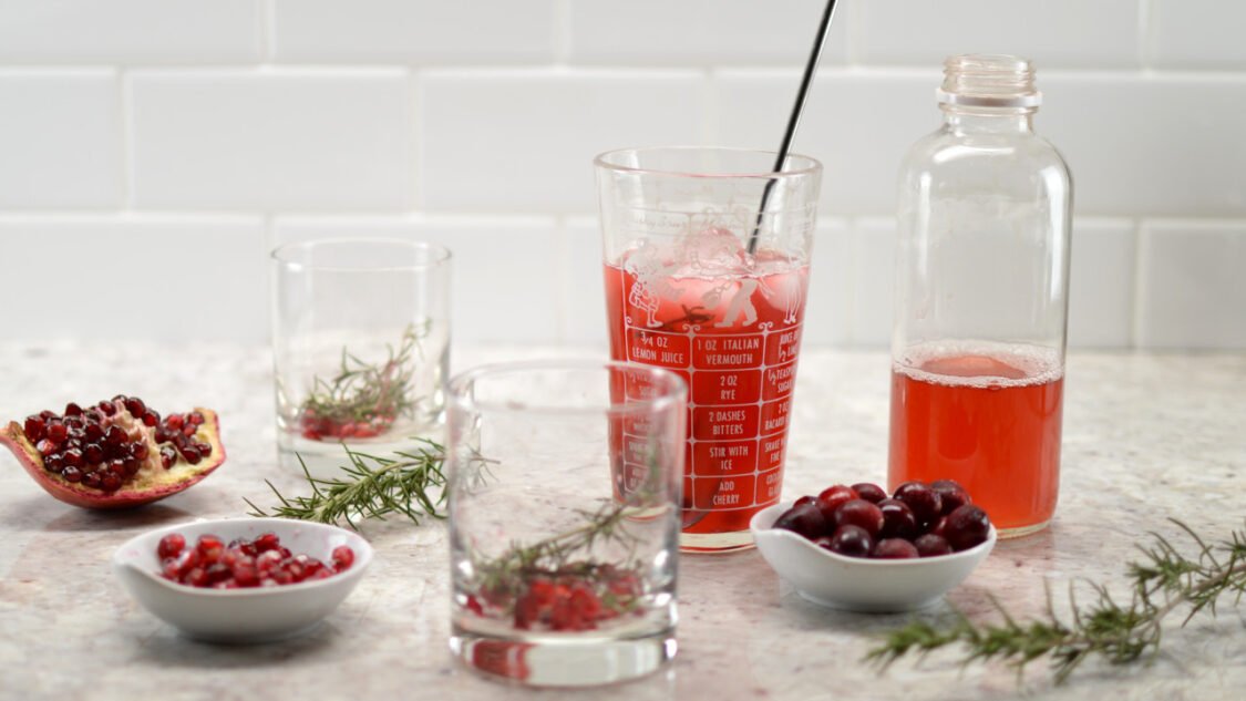 mixing cranberry pomegranate kombucha mocktail