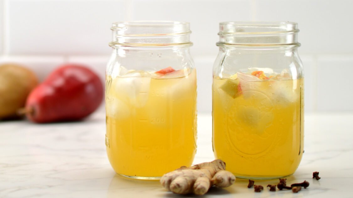 two glasses of spiced pear kombucha