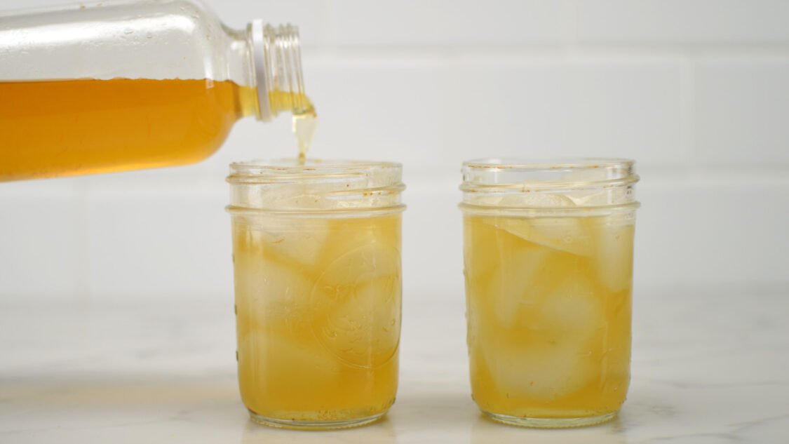 pouring orange blossom kombucha