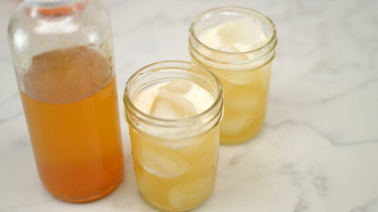 two glasses orange blossom kombucha