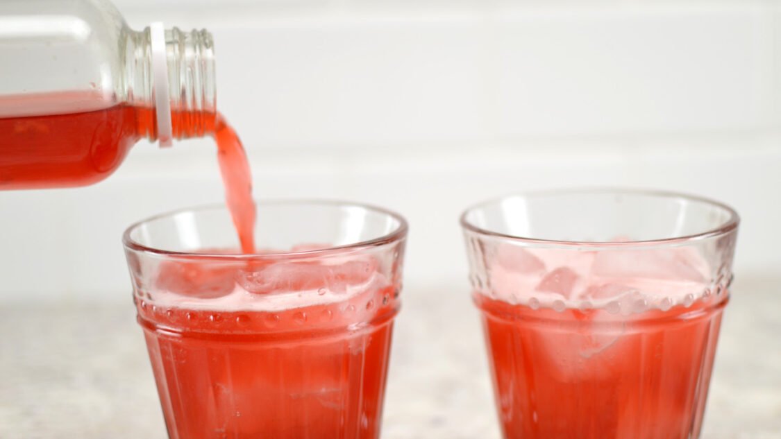 pouring raspberry lemonade kombucha